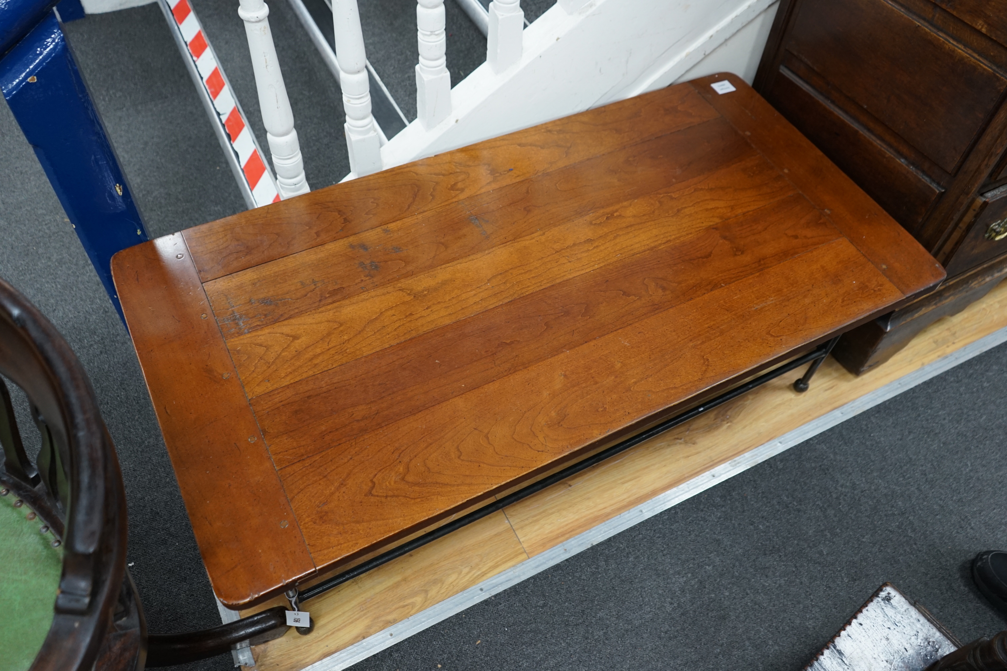 A modern rectanguar walnut and wrought iron coffee table, width 122cm depth 61cm height 41cm